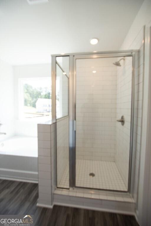 280 River Run Dr Unit 79, Dallas, GA 30132 - full bath featuring wood finished floors, a shower stall, and a bath