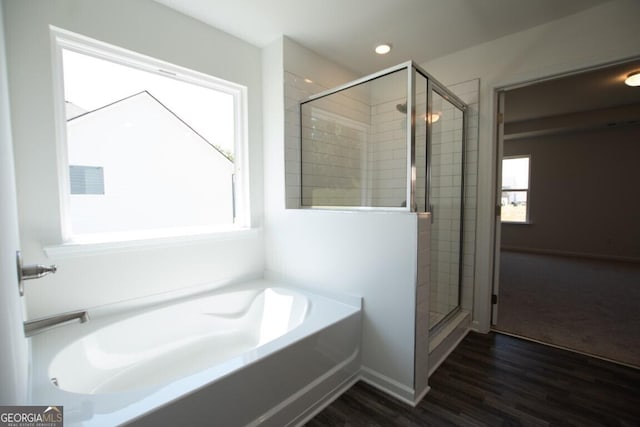 280 River Run Dr Unit 79, Dallas, GA 30132 - full bath featuring a garden tub, a shower stall, and wood finished floors