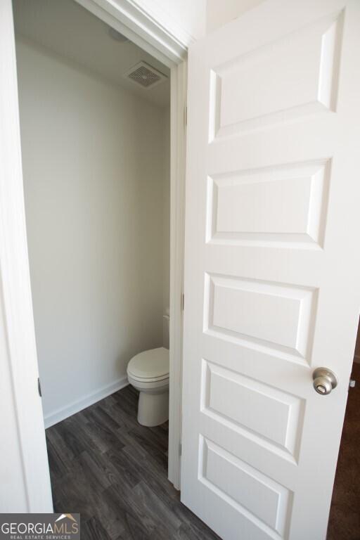 280 River Run Dr Unit 79, Dallas, GA 30132 - bathroom featuring toilet, wood finished floors, and baseboards
