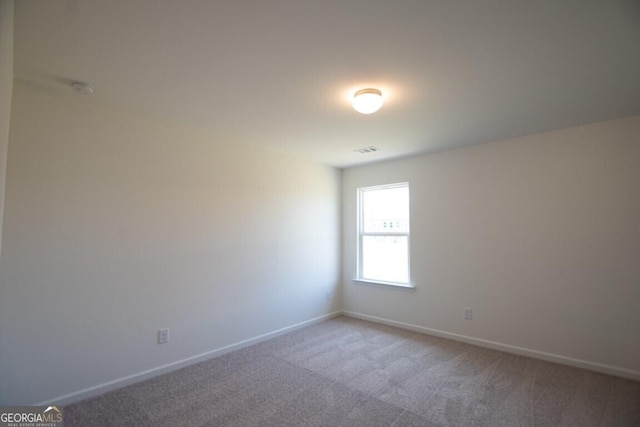 280 River Run Dr Unit 79, Dallas, GA 30132 - spare room with light carpet and baseboards