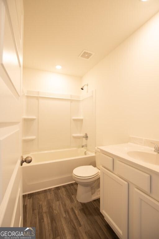 280 River Run Dr Unit 79, Dallas, GA 30132 - bathroom featuring toilet, vanity, wood finished floors, bathtub / shower combination, and recessed lighting