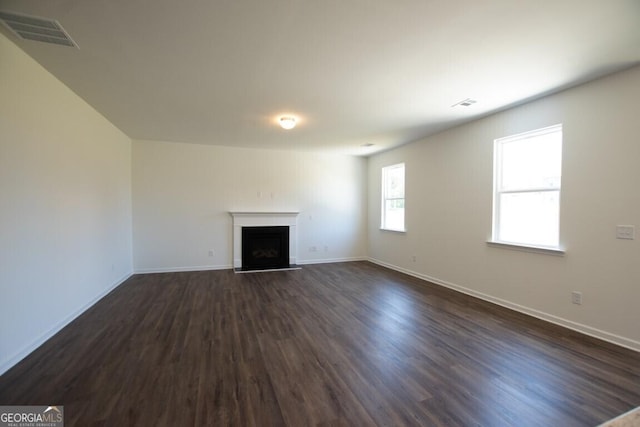280 River Run Dr Unit 79, Dallas, GA 30132 - unfurnished living room with a fireplace, dark wood-type flooring, and baseboards