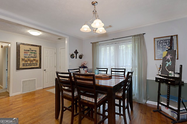 100 Huntcliff Ct, Lagrange, GA 30240 - dining room with ornamental molding, a chandelier, and hardwood / wood-style flooring