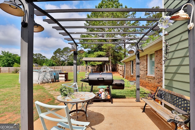 100 Huntcliff Ct, Lagrange, GA 30240 - fenced backyard featuring a pergola, a patio, and a grill