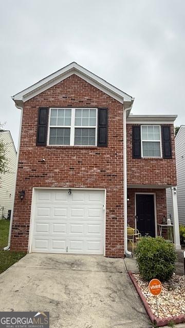 2080 Belmont Cir, Conyers, GA 30012 - view of front of house with an attached garage, concrete driveway, and brick siding