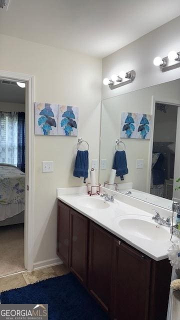 2080 Belmont Cir, Conyers, GA 30012 - ensuite bathroom with double vanity and tile patterned flooring