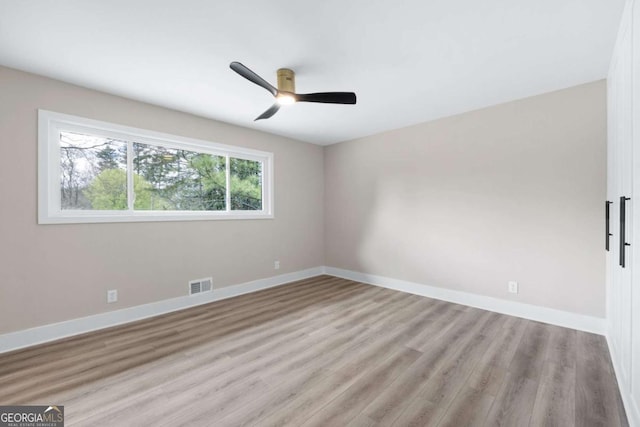 1120 Taliwa Trl NE, Marietta, GA 30068 - unfurnished room featuring wood finished floors and ceiling fan