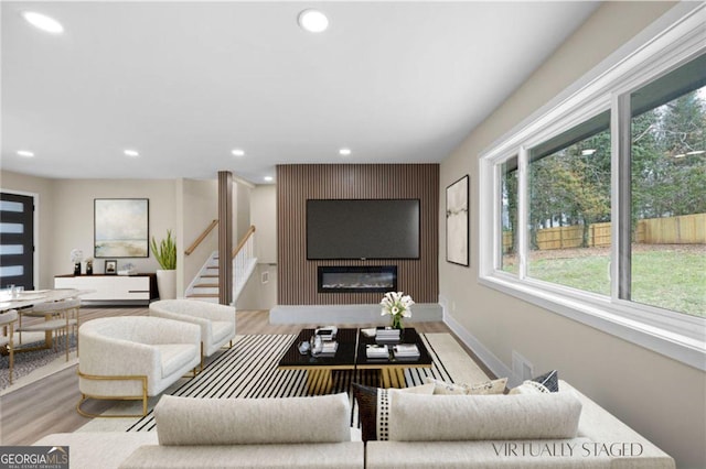 1120 Taliwa Trl NE, Marietta, GA 30068 - living area with a fireplace, recessed lighting, wood finished floors, and stairway