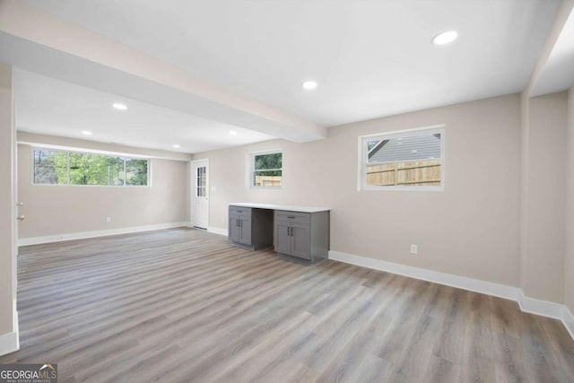 1120 Taliwa Trl NE, Marietta, GA 30068 - unfurnished living room with light wood finished floors, healthy amount of natural light, and recessed lighting