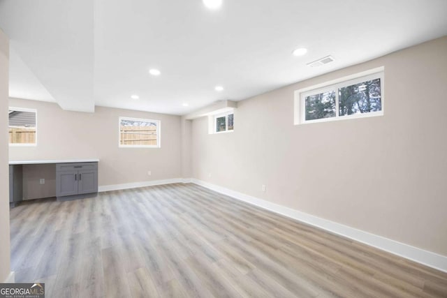 1120 Taliwa Trl NE, Marietta, GA 30068 - basement featuring plenty of natural light, light wood finished floors, and recessed lighting