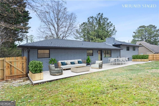 1120 Taliwa Trl NE, Marietta, GA 30068 - back of property featuring brick siding, outdoor lounge area, a patio, and a gate