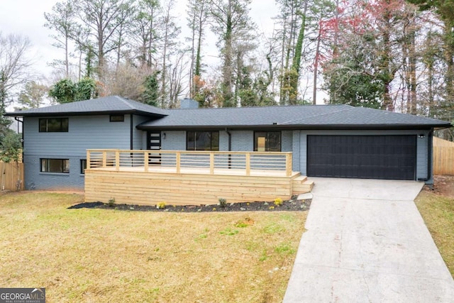 1120 Taliwa Trl NE, Marietta, GA 30068 - view of front of home with an attached garage, driveway, brick siding, and a chimney