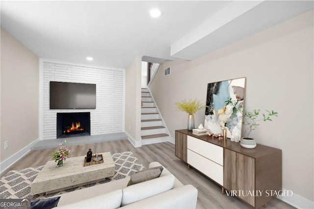 1120 Taliwa Trl NE, Marietta, GA 30068 - living room with stairs, light wood-style floors, recessed lighting, and a fireplace