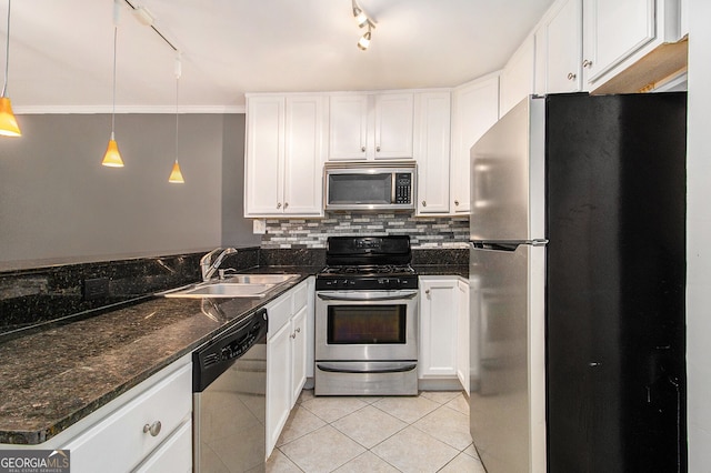 1445 Monroe Dr NE Unit F10, Atlanta, GA 30324 - kitchen with appliances with stainless steel finishes, light tile patterned floors, track lighting, and white cabinets