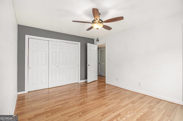 1445 Monroe Dr NE Unit F10, Atlanta, GA 30324 - unfurnished bedroom with light wood-style floors, a closet, and ceiling fan