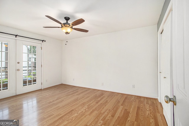 1445 Monroe Dr NE Unit F10, Atlanta, GA 30324 - empty room with light wood-style floors, a ceiling fan, and french doors