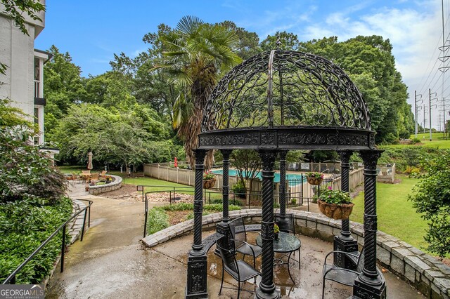 1445 Monroe Dr NE Unit F10, Atlanta, GA 30324 - view of patio featuring view of scattered trees
