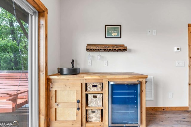 191 Rimrock Rd Unit 63, Jasper, GA 30143 - indoor dry bar featuring wine cooler, wood finished floors, and baseboards