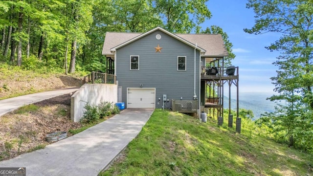 191 Rimrock Rd Unit 63, Jasper, GA 30143 - view of front of home featuring concrete driveway, a garage, a water view, and a front yard