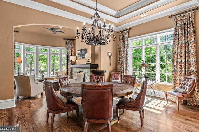 1031 Sugar Run, Greensboro, GA 30642 - dining area featuring ornamental molding, ceiling fan, healthy amount of natural light, wood finished floors, and a chandelier