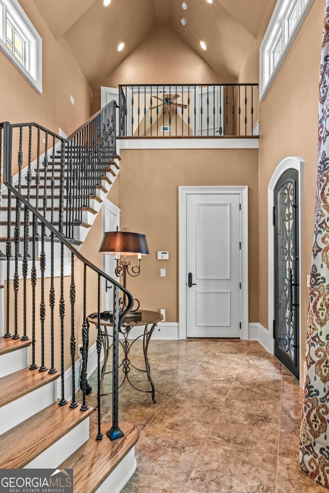 1031 Sugar Run, Greensboro, GA 30642 - foyer entrance featuring high vaulted ceiling, recessed lighting, and stairway