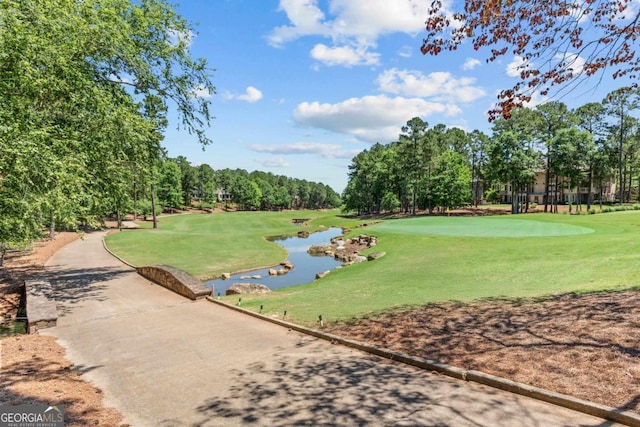 1031 Sugar Run, Greensboro, GA 30642 - view of home's community featuring golf course view, a water view, view of scattered trees, and a yard