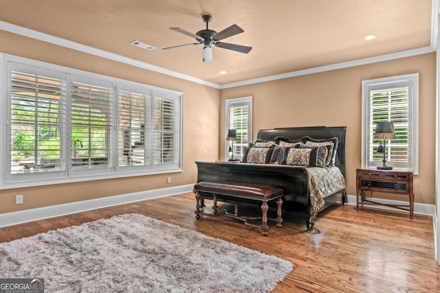 1031 Sugar Run, Greensboro, GA 30642 - bedroom with crown molding, wood finished floors, and a ceiling fan