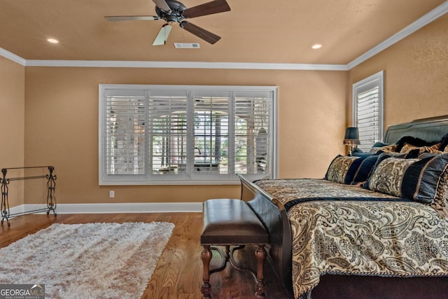 1031 Sugar Run, Greensboro, GA 30642 - bedroom featuring multiple windows, wood finished floors, crown molding, recessed lighting, and a ceiling fan