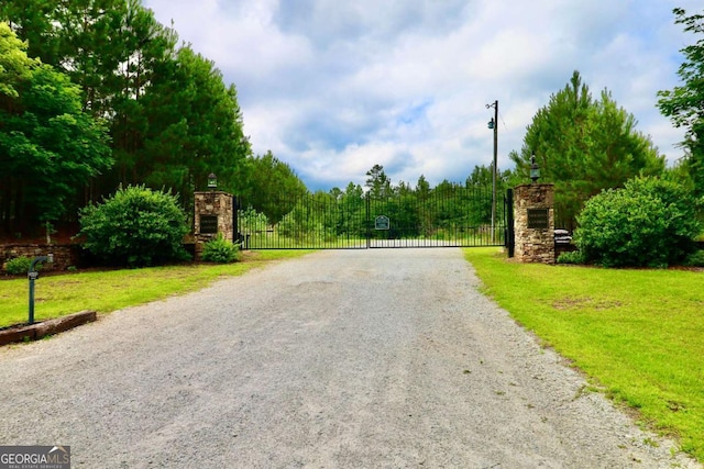 0 Millstone Creek Rd, Elberton, GA 30635 - view of dirt / gravel road featuring a gate and a gated entry