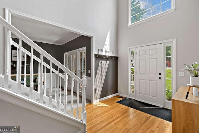 117 Willow View Ln, Canton, GA 30114 - foyer featuring wood finished floors, a high ceiling, stairs, and ornamental molding