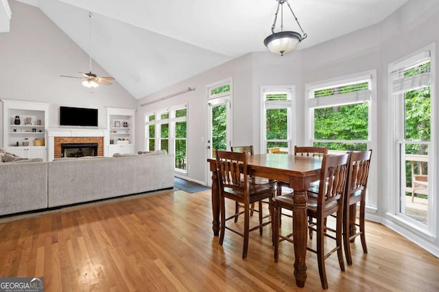 117 Willow View Ln, Canton, GA 30114 - dining room featuring built in features, plenty of natural light, light wood finished floors, and high vaulted ceiling