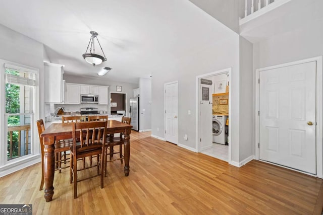 117 Willow View Ln, Canton, GA 30114 - dining room with washer / clothes dryer and light wood-style floors