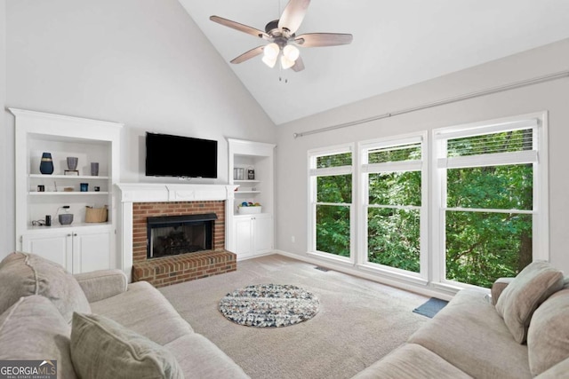117 Willow View Ln, Canton, GA 30114 - carpeted living area with high vaulted ceiling, ceiling fan, a brick fireplace, and built in features