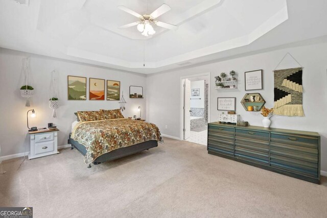 117 Willow View Ln, Canton, GA 30114 - carpeted bedroom featuring a tray ceiling, ceiling fan, and ensuite bath