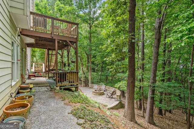 117 Willow View Ln, Canton, GA 30114 - view of yard featuring a wooden deck, a fire pit, a patio, and stairway