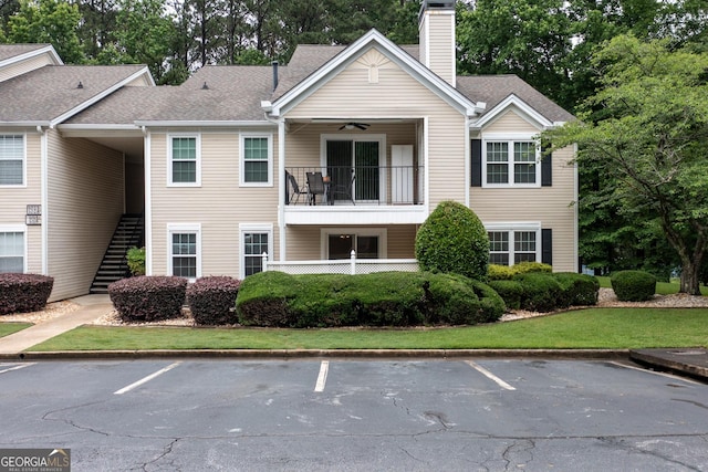1017 Ridgefield Dr, Peachtree City, GA 30269 - view of property with stairway and uncovered parking