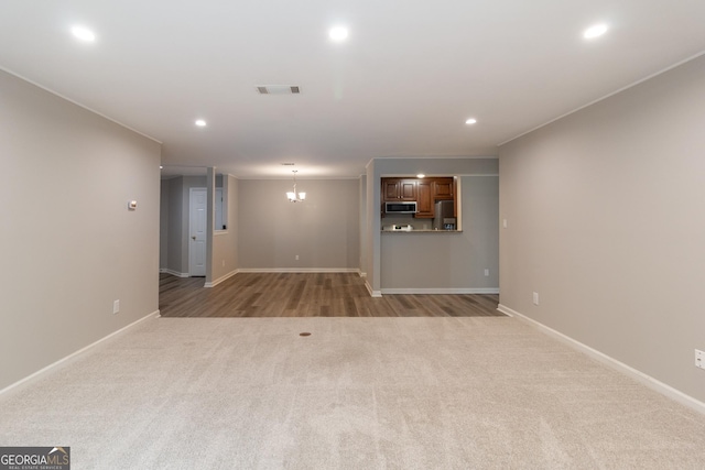 1017 Ridgefield Dr, Peachtree City, GA 30269 - unfurnished living room with light carpet, recessed lighting, and baseboards
