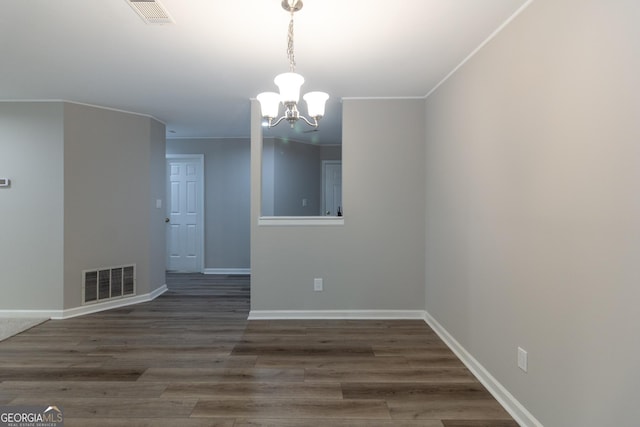 1017 Ridgefield Dr, Peachtree City, GA 30269 - empty room featuring a chandelier, baseboards, crown molding, and wood finished floors