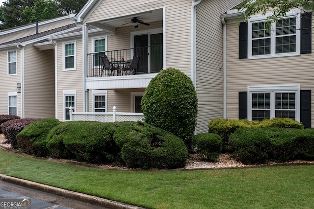 1017 Ridgefield Dr, Peachtree City, GA 30269 - view of side of property featuring ceiling fan, a yard, and a balcony