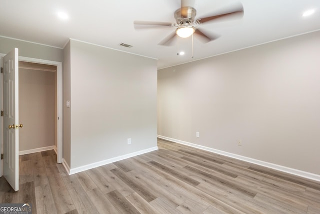 1017 Ridgefield Dr, Peachtree City, GA 30269 - spare room featuring a ceiling fan, light wood-style flooring, baseboards, recessed lighting, and crown molding