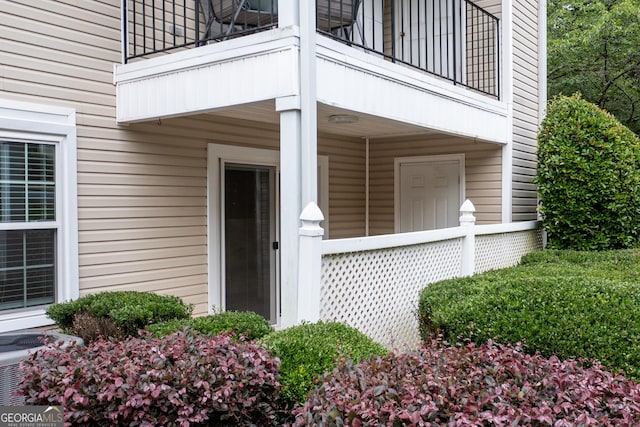 1017 Ridgefield Dr, Peachtree City, GA 30269 - doorway to property with a balcony and central AC