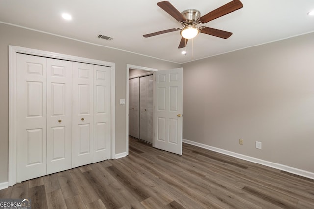 1017 Ridgefield Dr, Peachtree City, GA 30269 - unfurnished bedroom featuring baseboards, wood finished floors, a closet, a ceiling fan, and recessed lighting