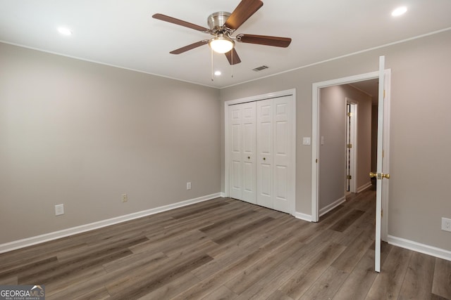 1017 Ridgefield Dr, Peachtree City, GA 30269 - unfurnished bedroom with wood finished floors, baseboards, recessed lighting, a closet, and ceiling fan