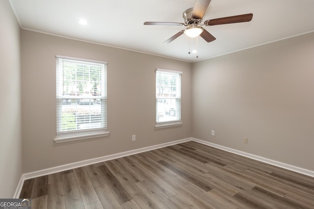 1017 Ridgefield Dr, Peachtree City, GA 30269 - empty room featuring plenty of natural light, wood finished floors, ceiling fan, and ornamental molding