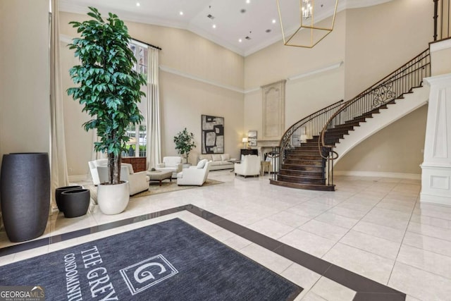 3280 Stillhouse Ln SE Unit 212, Atlanta, GA 30339 - building lobby with a towering ceiling, stairway, ornamental molding, and recessed lighting