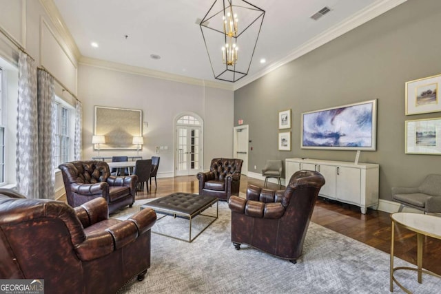 3280 Stillhouse Ln SE Unit 212, Atlanta, GA 30339 - living room with wood finished floors, a chandelier, crown molding, and recessed lighting