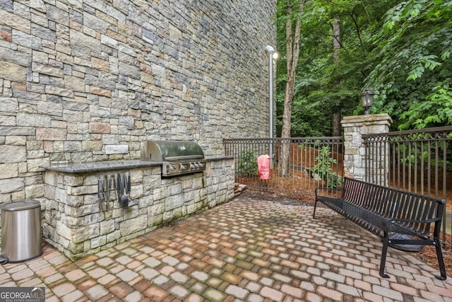 3280 Stillhouse Ln SE Unit 212, Atlanta, GA 30339 - view of patio with an outdoor kitchen