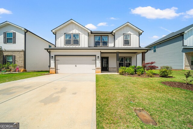4720 Dufour Dr, Lilburn, GA 30047 - craftsman inspired home featuring board and batten siding, a garage, concrete driveway, and a front lawn