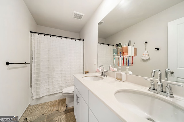 4720 Dufour Dr, Lilburn, GA 30047 - full bathroom with double vanity and tile patterned flooring