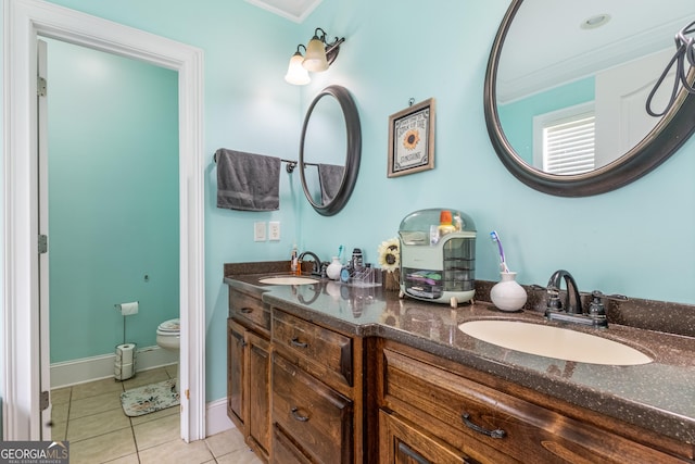 23 Raleigh Dr, Lafayette, GA 30728 - bathroom with toilet, double vanity, tile patterned flooring, crown molding, and baseboards